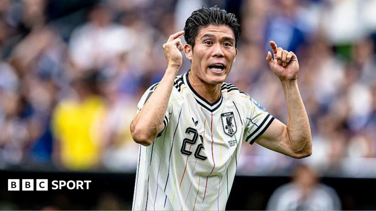 Takehiro Tomiyasu of Japan looks on
