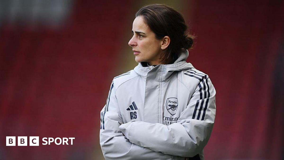 Arsenal and Liverpool players contest a ball in a Women’s Super League match