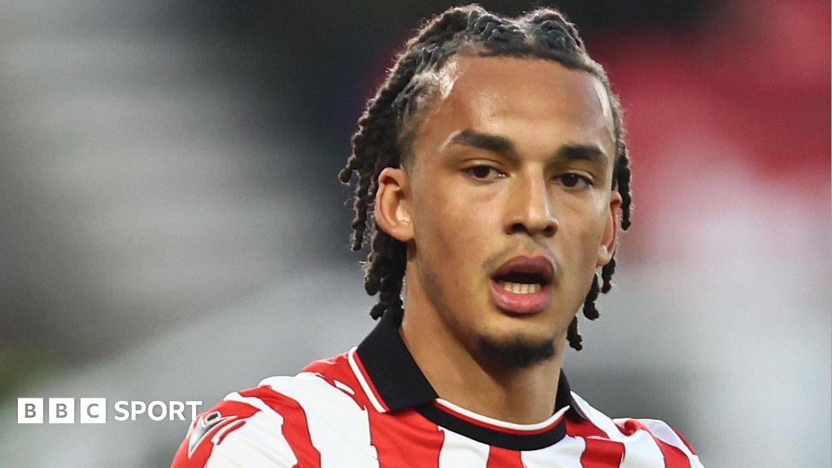 Boro sign Spurs defender Phillips on five-year deal - BBC