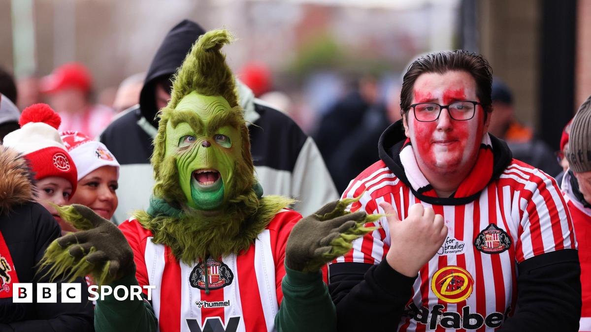 Premier League match action in a packed stadium