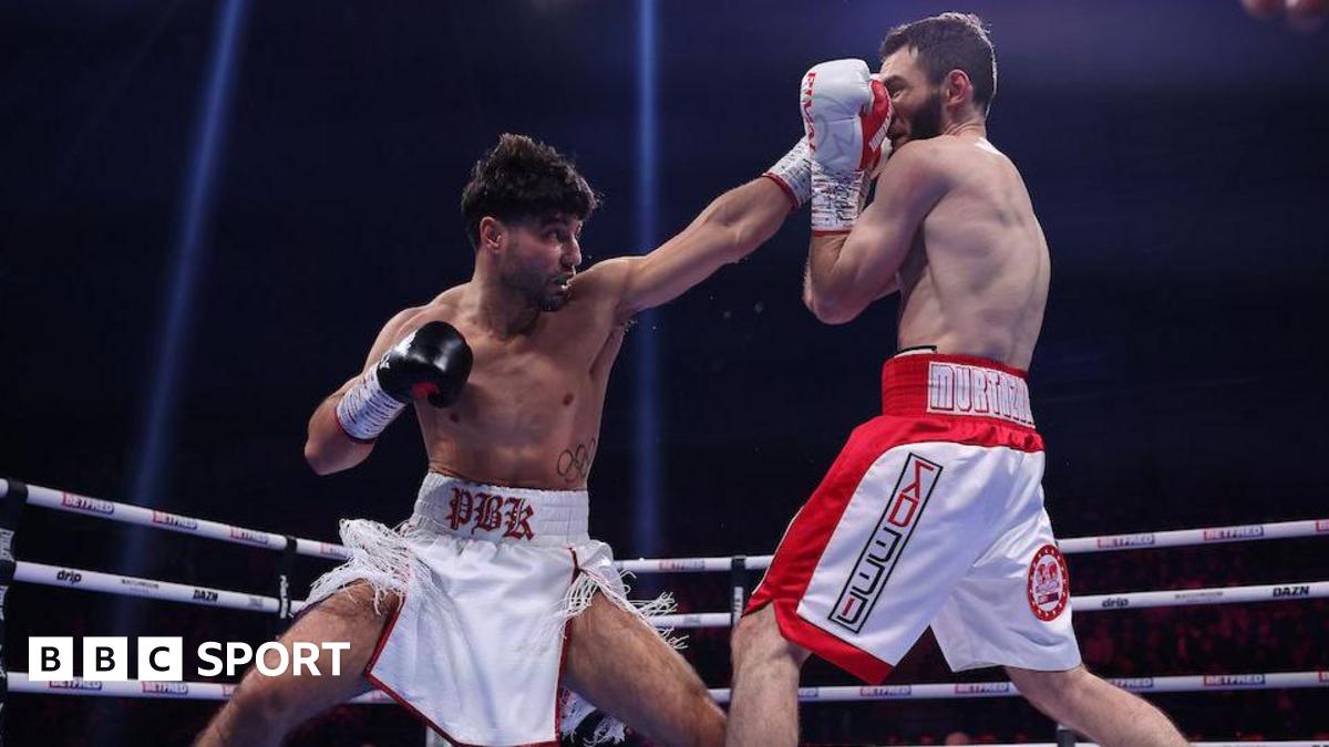 Kelly outpoints Murtazaliev to win world title