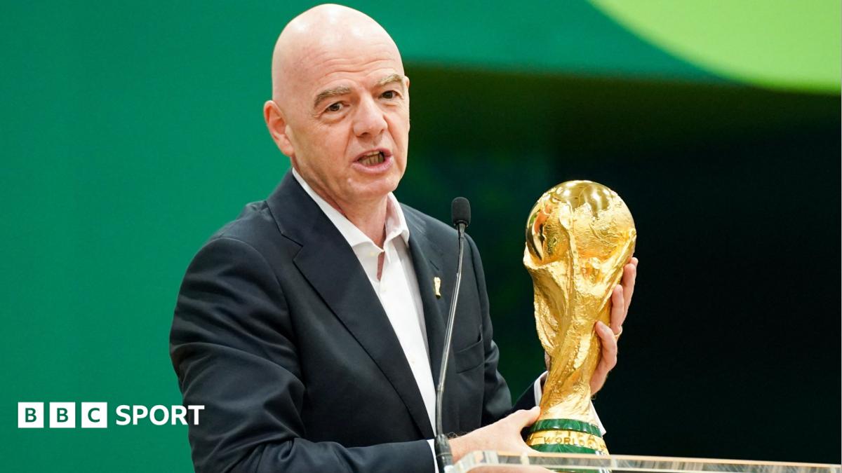 Gianni Infantino with the World Cup trophy at a pre-tournament news conference