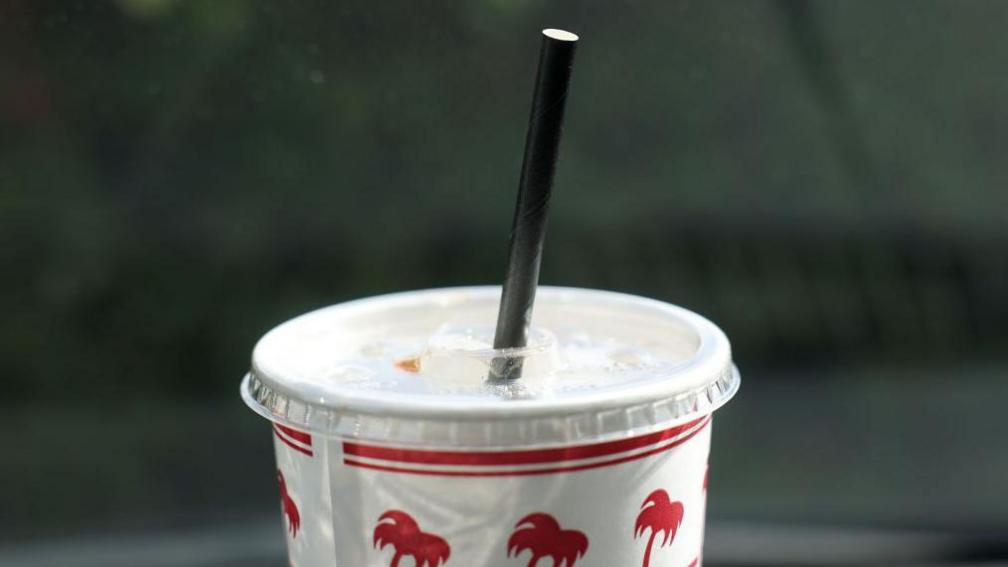 Paper straw in a cup.