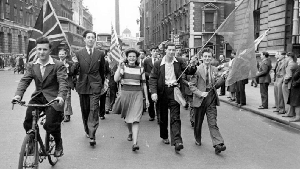 8th May 1945: Students from London University stage an impromptu VE Day parade. Original Publication: Picture Post - 1991 - This Was VE Day In London - pub. 1945