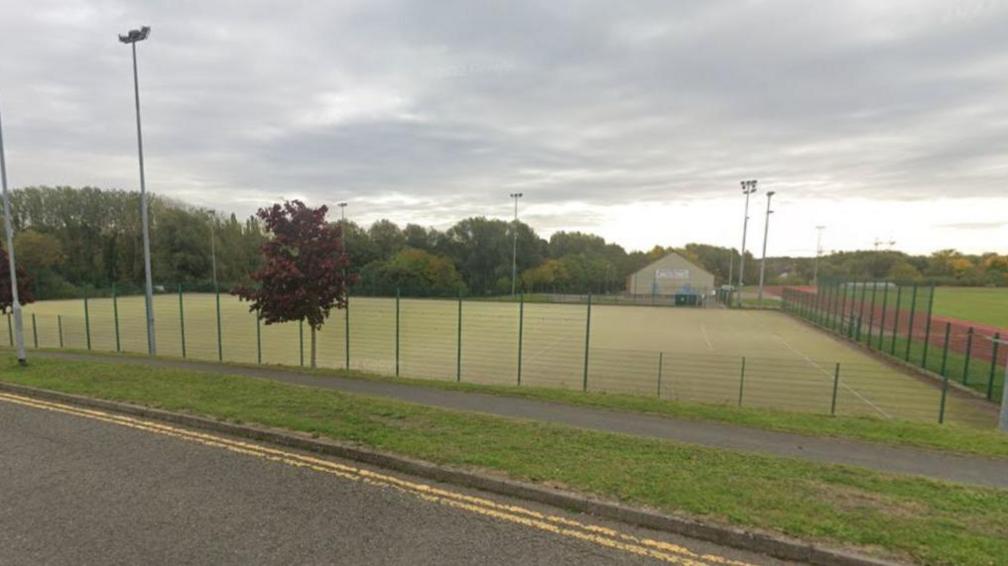 A wide view of the sports pitch as seen from a Google streetview camera.