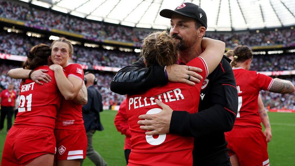 Kevin Rouet hugs Justine Pelletier 