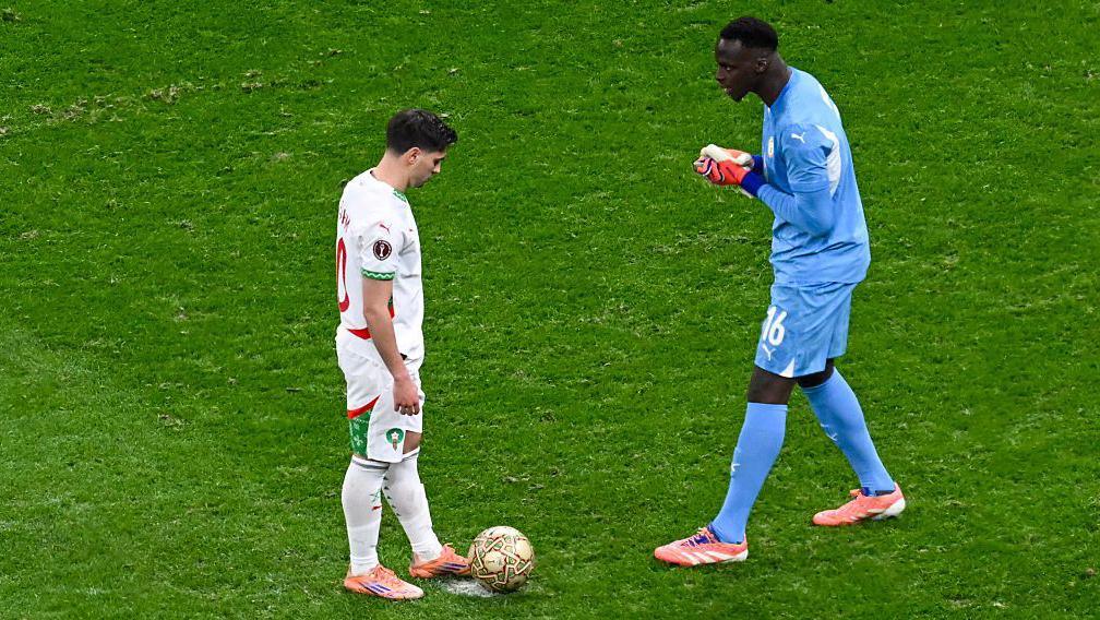 Edouard Mendy confronts Brahim Diaz before his penalty