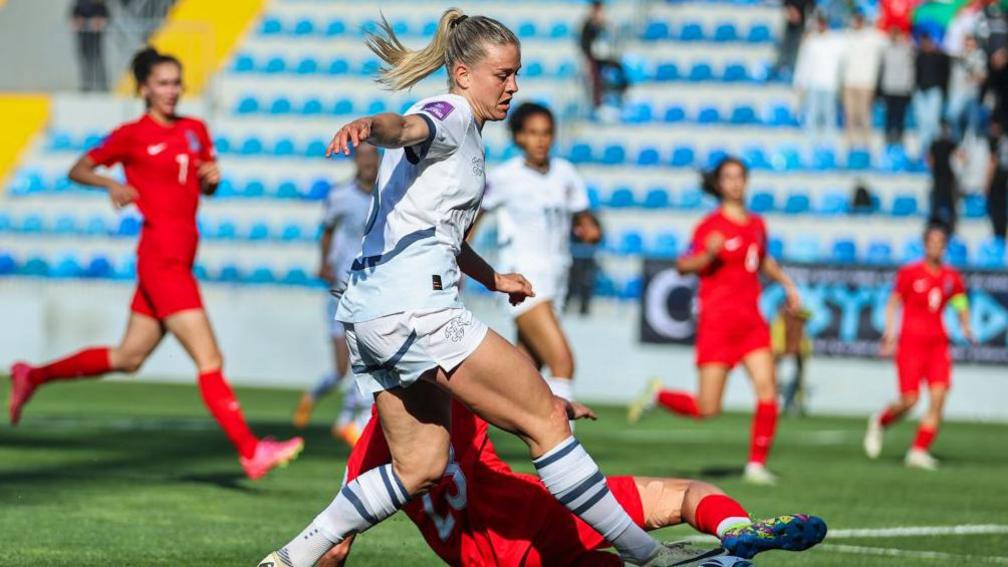 Nadin Riesenl (8) of Switzerland and Yeliz Acar (23) of Azerbaijan fight the ball during the UEFA Women's European Qualifier match between Azerbaijan and Switzerland at Dalga Arena.