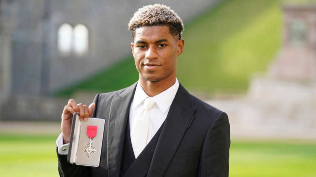 Marcus Rashford being awarded his MBE.