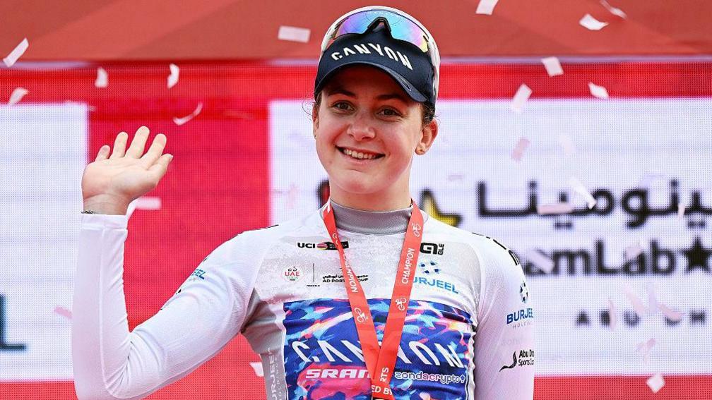 Zoe Backstedt celebrates in the White jersey as best young rider winner during the UAE Women's Tour 2026