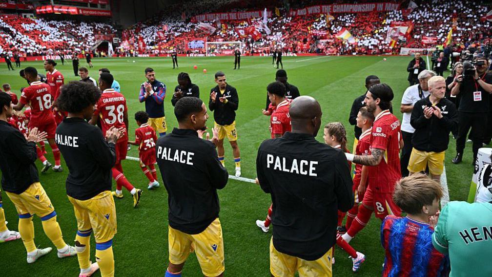 The Crystal Palace players line up to give their Liverpool counterparts a guard of honour before kick-off