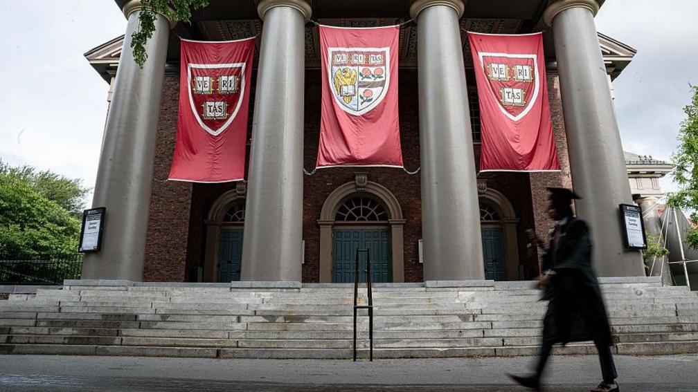 Harvard University prepares for graduation, with banners hanging from buildings