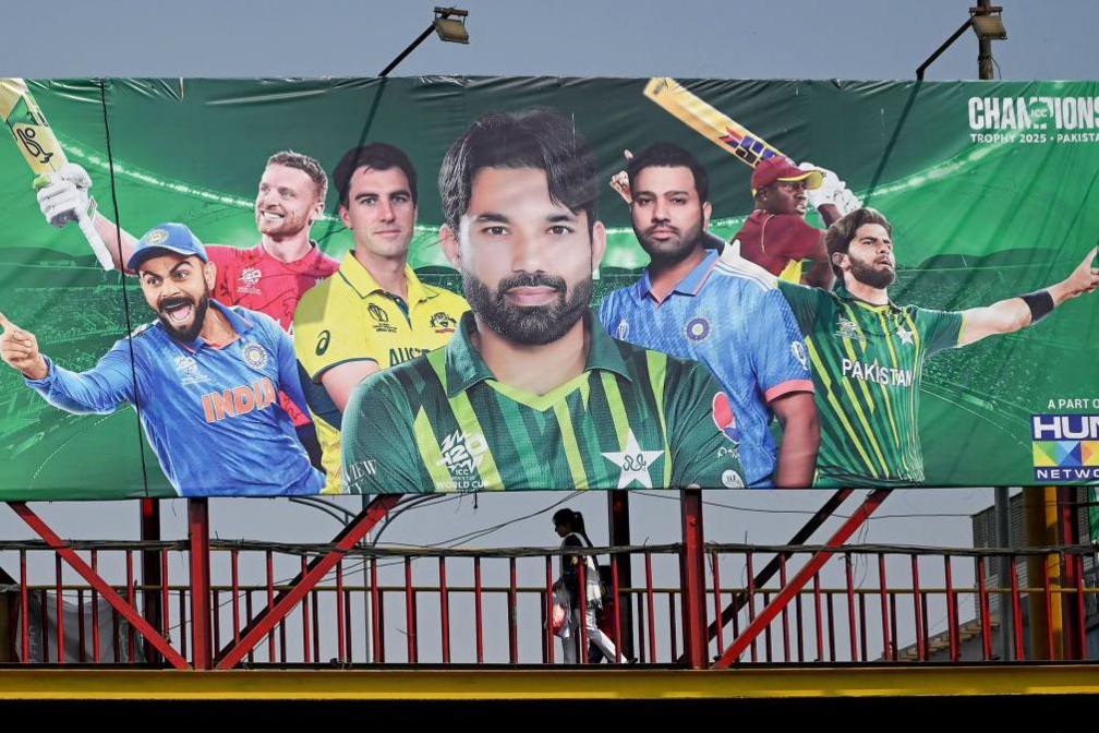 A billboard depicts Indian cricket captain Rohit Sharma (2L) ahead of Champions Trophy in Lahore on February 15, 2025