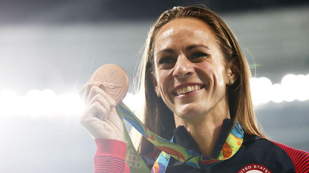Jenny Simpson holds up her bronze medal at the Rio Games in 2016 