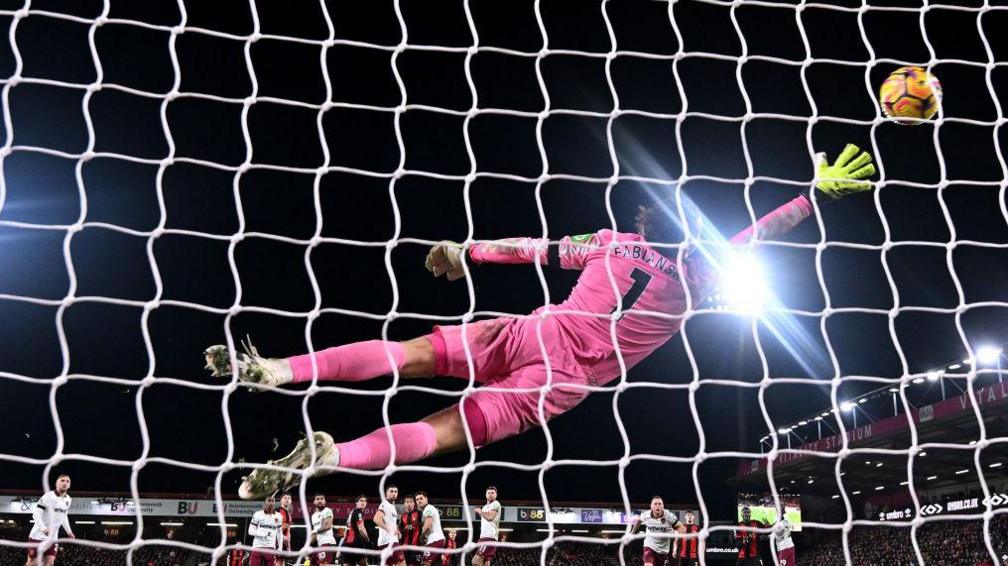 Lukasz Fabianski of West Ham United fails to save as Enes Uenal of AFC Bournemouth scores his team's first goal from a freekick during the Premier League match between AFC Bournemouth and West Ham United FC at Vitality Stadium