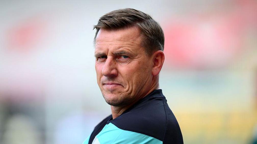Tony Pennock looking side on from the touchline