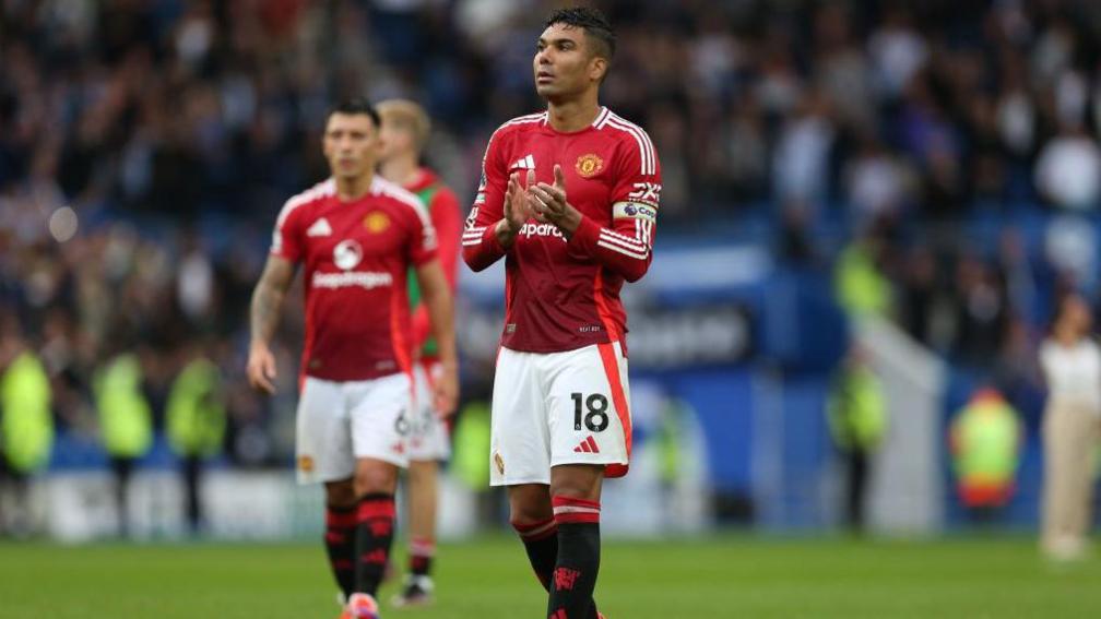 Casemiro applauds the Manchester United fans after the Premier League match at Brighton