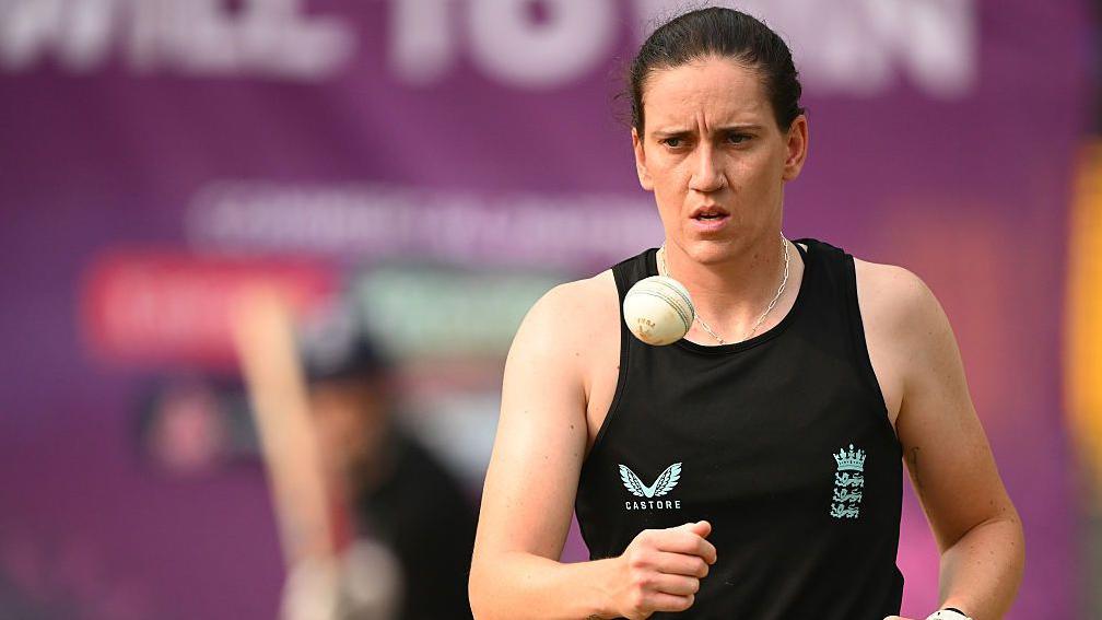 Em Arlott tosses a white ball up in the air in training for England at last year's World Cup