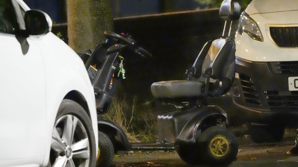 A black and grey mobility scooter was pictured at the crime scene on Wednesday evening