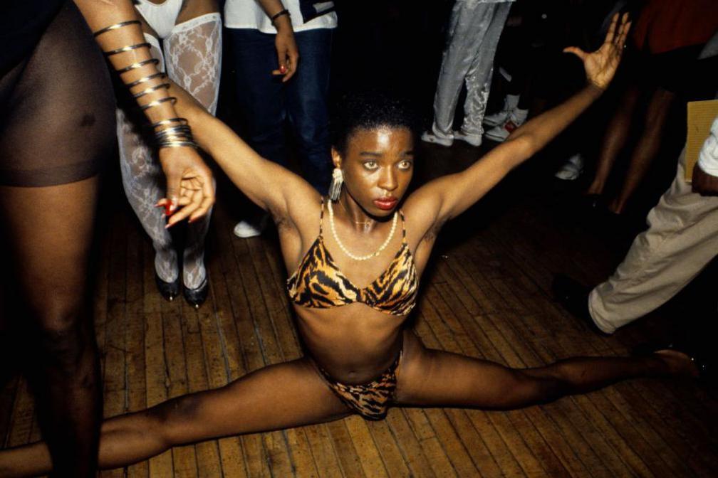 A performer in an animal print bikini at a drag ball in 1988 in New York City, New York.