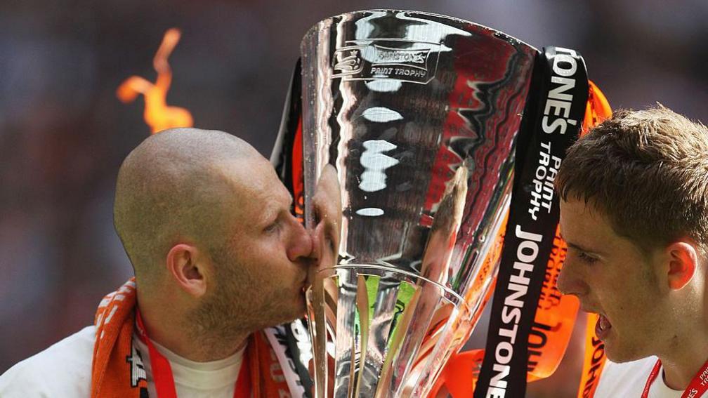 Kevin Nicholls of Luton Town kisses the trophy after victory in the Johnstone's Paint Trophy Final match between Luton Town and Scunthorpe United at Wembley Stadium in 2009