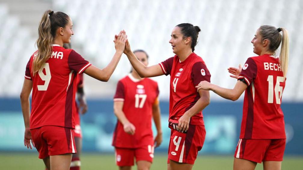 Canada players celebrate