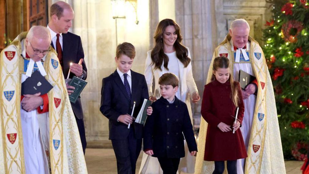 Catherine, Princess of Wales, Prince Louis of Wales, Princess Charlotte of Wales, Prince William, Prince of Wales and Prince George of Wales process out of The "Together At Christmas" Carol Service at Westminster Abbey on December 08, 2023 in London, England.