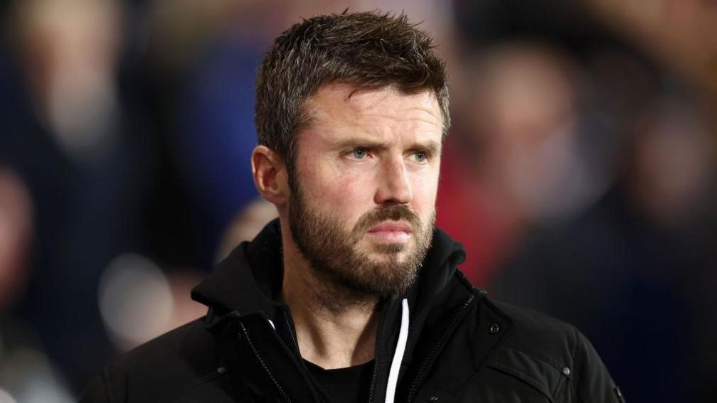 Michael Carrick stood on the touchline watching a Middlesbrough match  