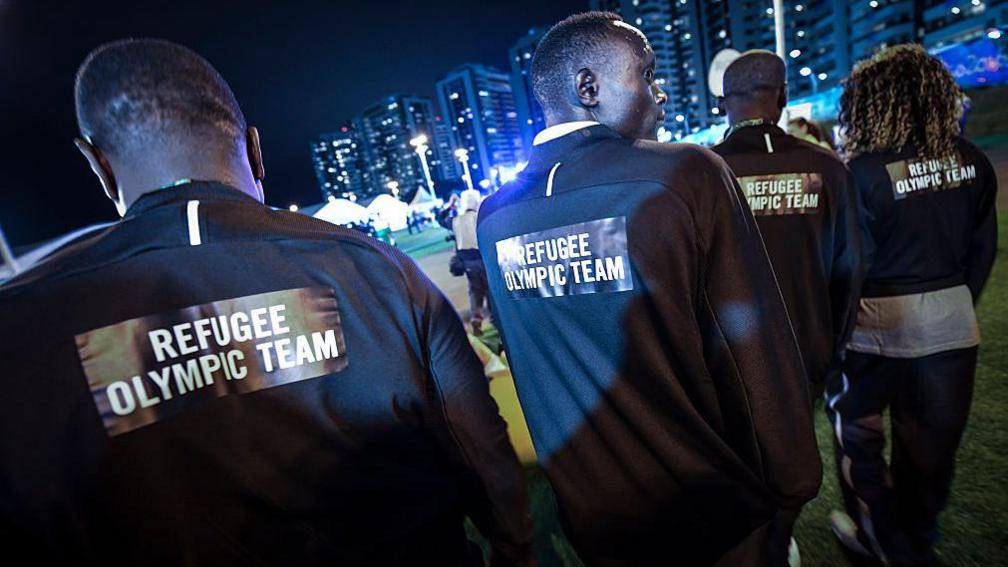  Refugee Olympic Team athletes for the Rio 2016 Olympic Games attend their welcome ceremony at the Athletes village on August 3, 2016 in Rio de Janeiro, Brazil.