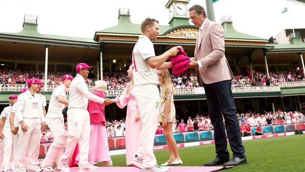 Australia players wearing pink caps