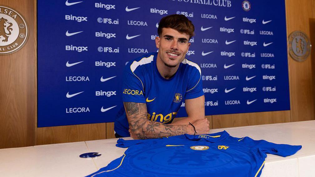 Pep Chavarria with a Chelsea shirt