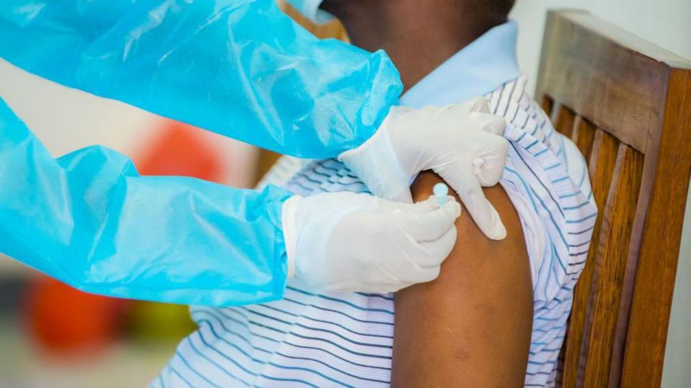 A man receiving a vaccine