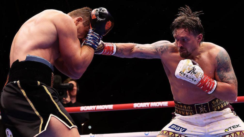 Oleksandr Usyk lands a punch on Rico Verhoeven