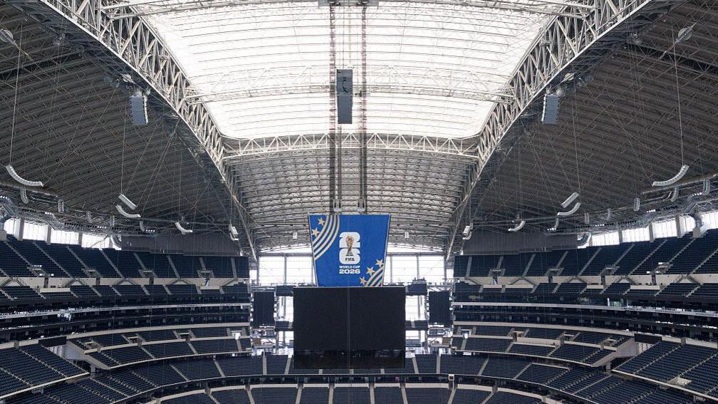 image of the large and empty Dallas stadium which shows the roof closed as preparations are made for the World Cup