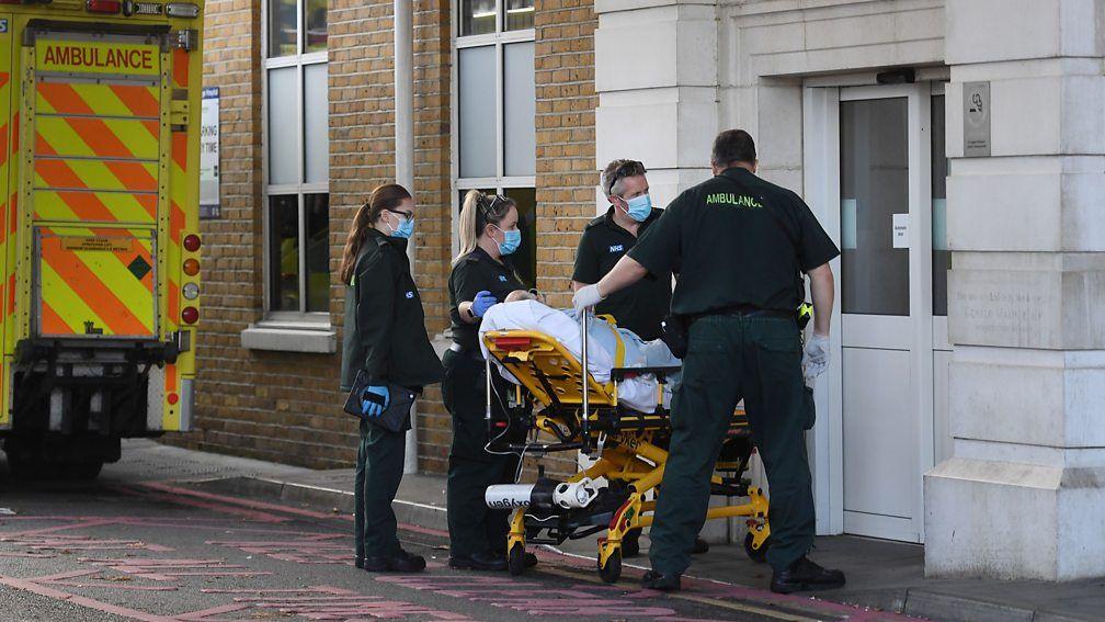 Ambulance crew takes a patient into hospital