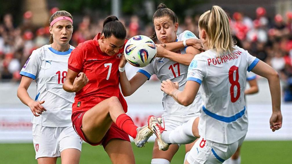 Czech Republic's Kamila Dubcova, Barbora Polcarova and Aneta Pochmanova fight for the ball with Switzerland's Riola Xhemaili during a friendly in June 