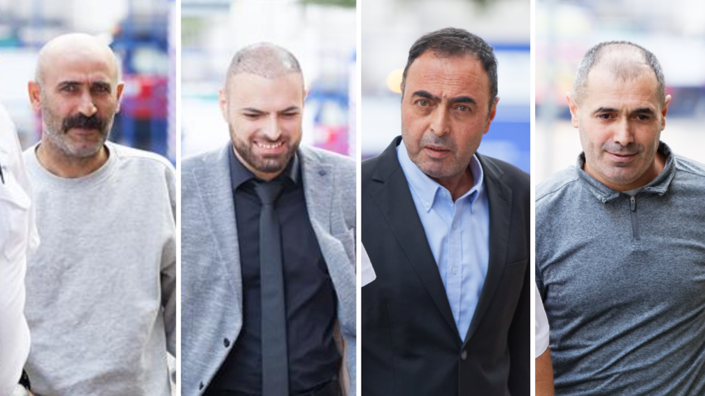 A composite image of four men. The one on the far left is bald with a stubbly grey beard and black moustache, with a grey sweatshirt. The one next to him is a bald man looking to the ground with a grey jacket and black tie and black shirt. The one next to him has short black hair and a black jacket and light blue shirt. The one on the right is balding with a light grey t-shirt.