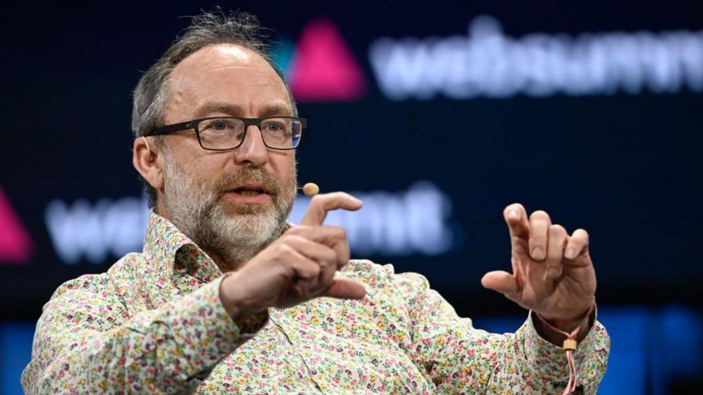 LISBON, PORTUGAL - NOVEMBER 13: Founder of Wikipedia Jimmy Wales talks onstage about Artificial Intelligence during Web Summit opening night on November 13, 2023 in Lisbon, Portugal. The annual conference brings together founders and CEOs of technology companies, as well as policymakers, to discuss the future of the Web. The 2023 event is expected to reach full capacity at more than 70,000 attendees from 160 countries, plus 2,600 startups and more than 300 partners who will be present to interact with more than 800 speakers and some 2,000 members of the media. This year's summit on the Internet technology industry is the first under the newly appointed Web Summit CEO Katherine Maher, who replaced Paddy Cosgrave following his resignation last month. (Photo by Horacio Villalobos#Corbis/Getty Images)