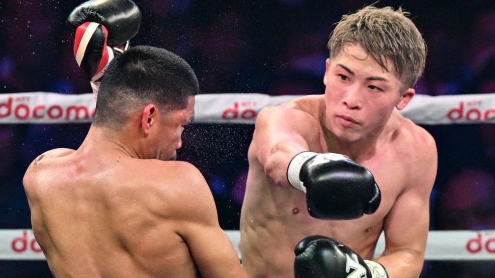 Naoya Inoue throws a punch at Marlon Tapales in Tokyo