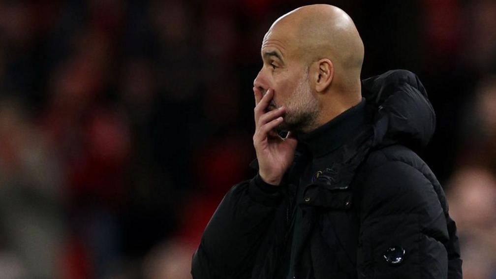 Manchester City manager Pep Guardiola on the touchline at Anfield