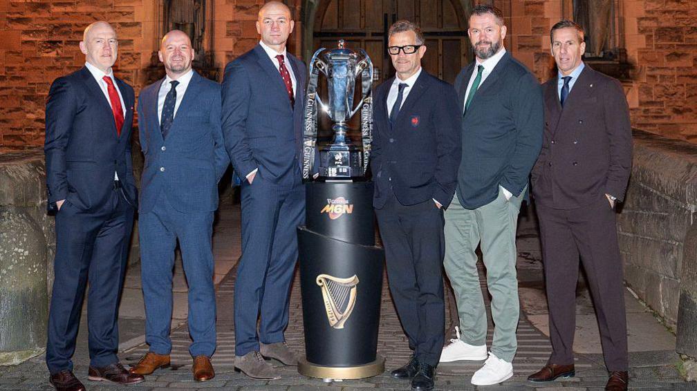 The Six Nations coaches line up for a picture with the trophy in Edinburgh