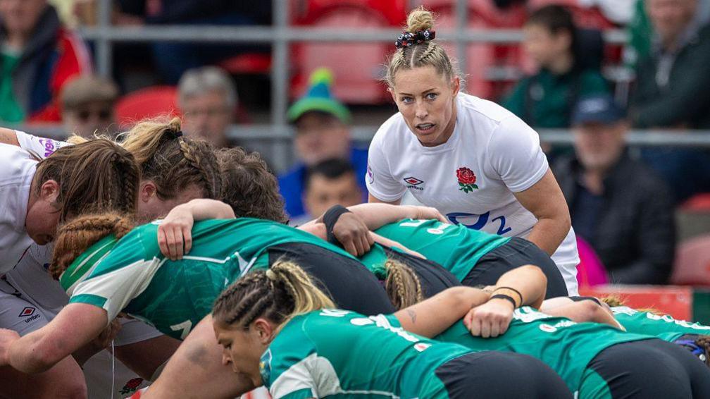 Natasha Hunt feeds the ball into a scrum