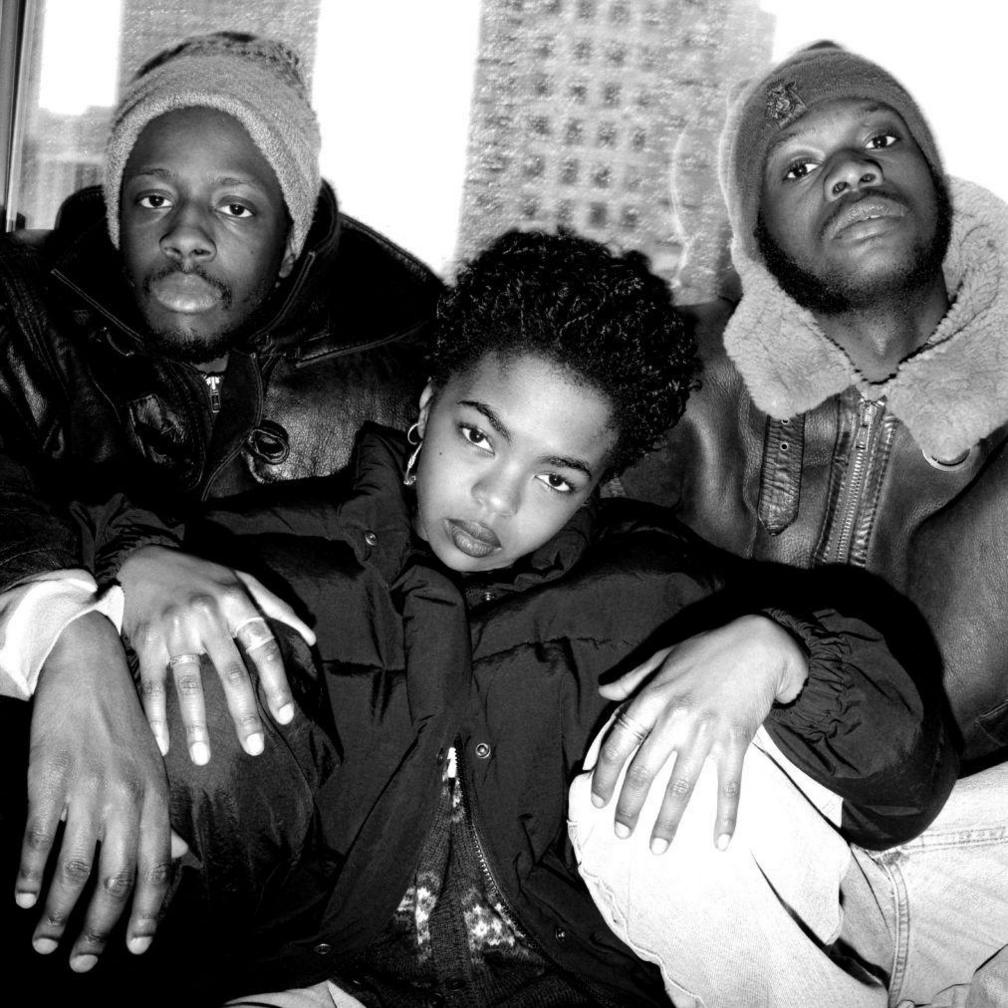 Lauryn Hill posing with Wyclef Jean and Pras Michel in the 90s