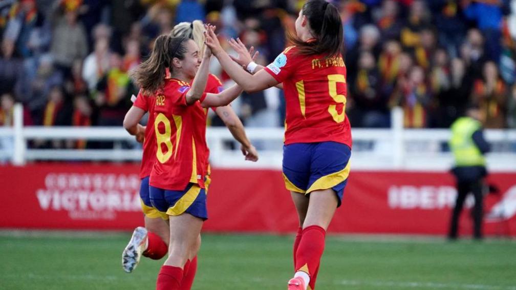 Spain's defender #05 Maria Mendez celebrates with Spain's forward #08 Mariona Caldentey after scoring during the UEFA Women's Euro 2025 group A qualifying round