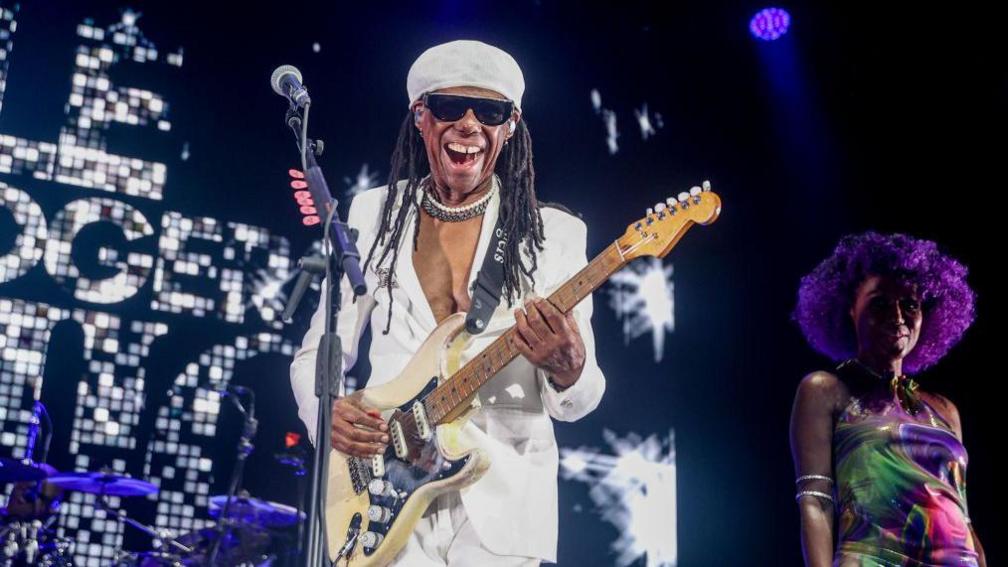 Nile Rodgers playing on stage