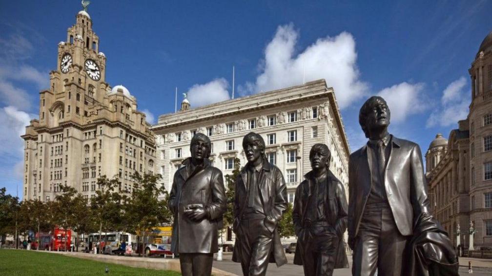 The Beatles statue at Pier Head in front of the Liver Building