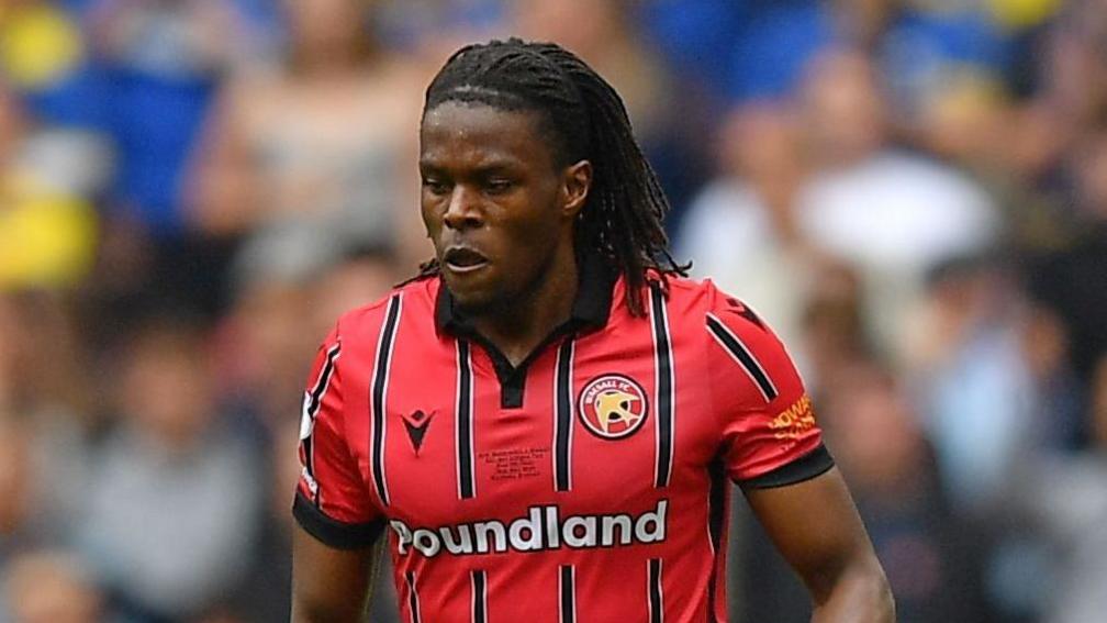 Nathan Asiimwe in action during the League Two play-off final