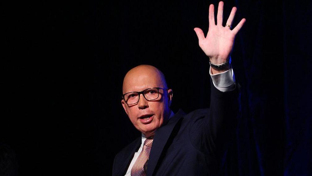 Australia's Opposition Leader Peter Dutton waves after conceding defeat in the general election at the Liberal Party election night event in Brisbane on May 3, 2025.