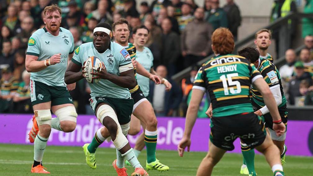 Emeka Ilione runs with the ball for Leicester