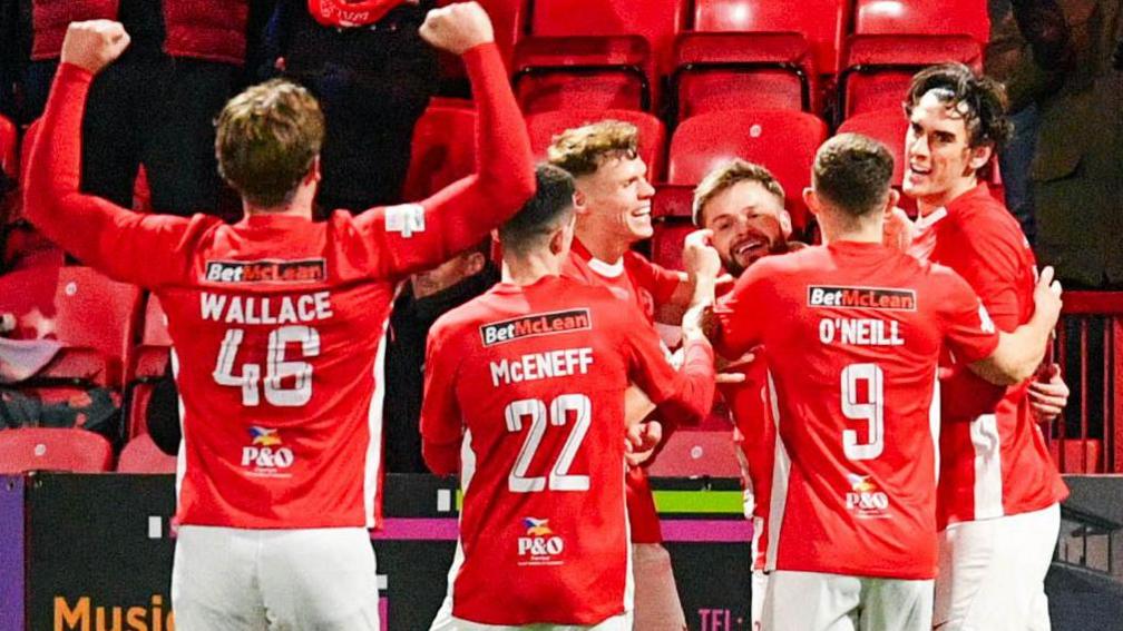 Andy Ryan celebrates scoring for Larne against Coleraine on Friday night